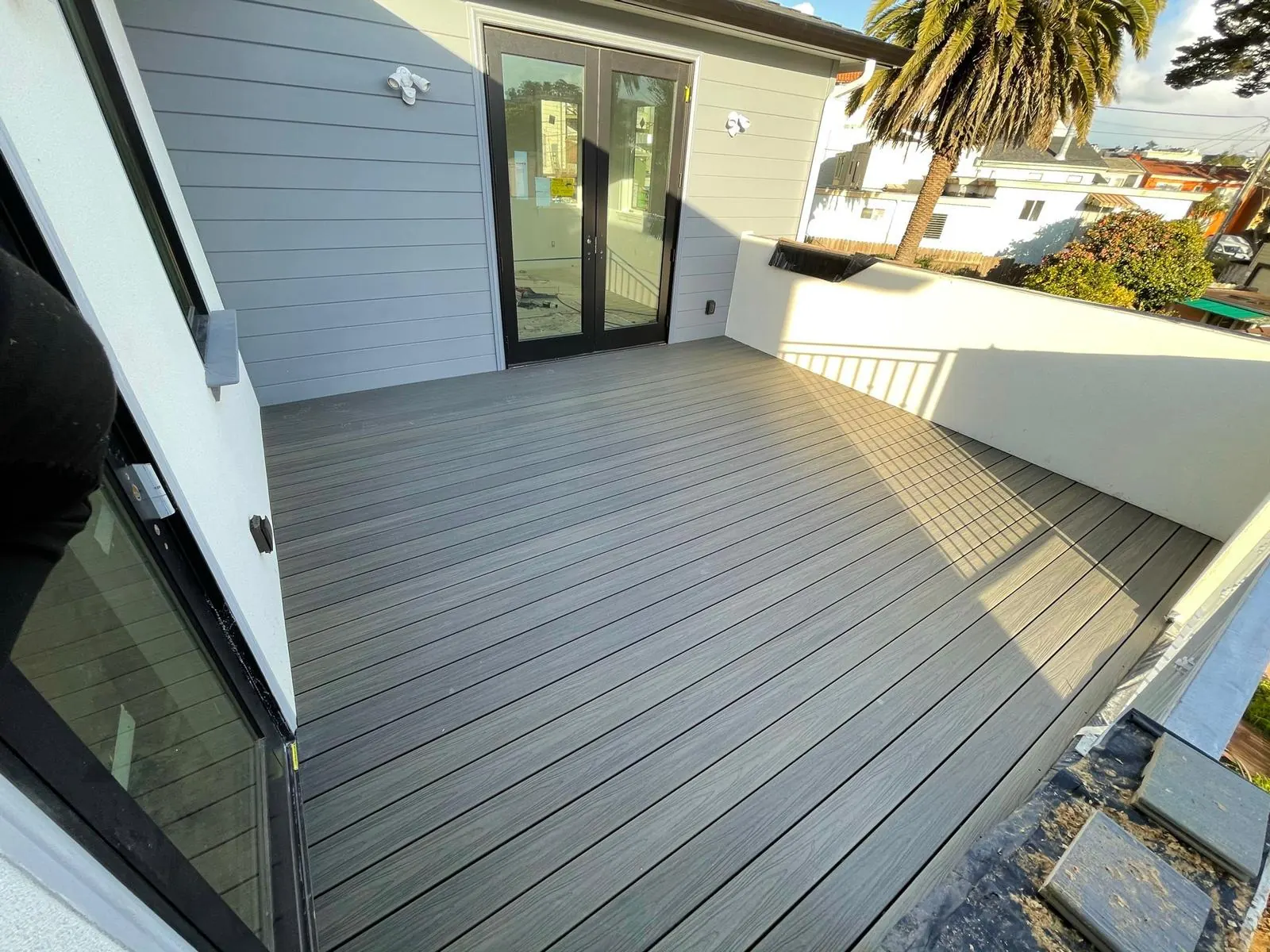 Gray composite deck outside sliding doors