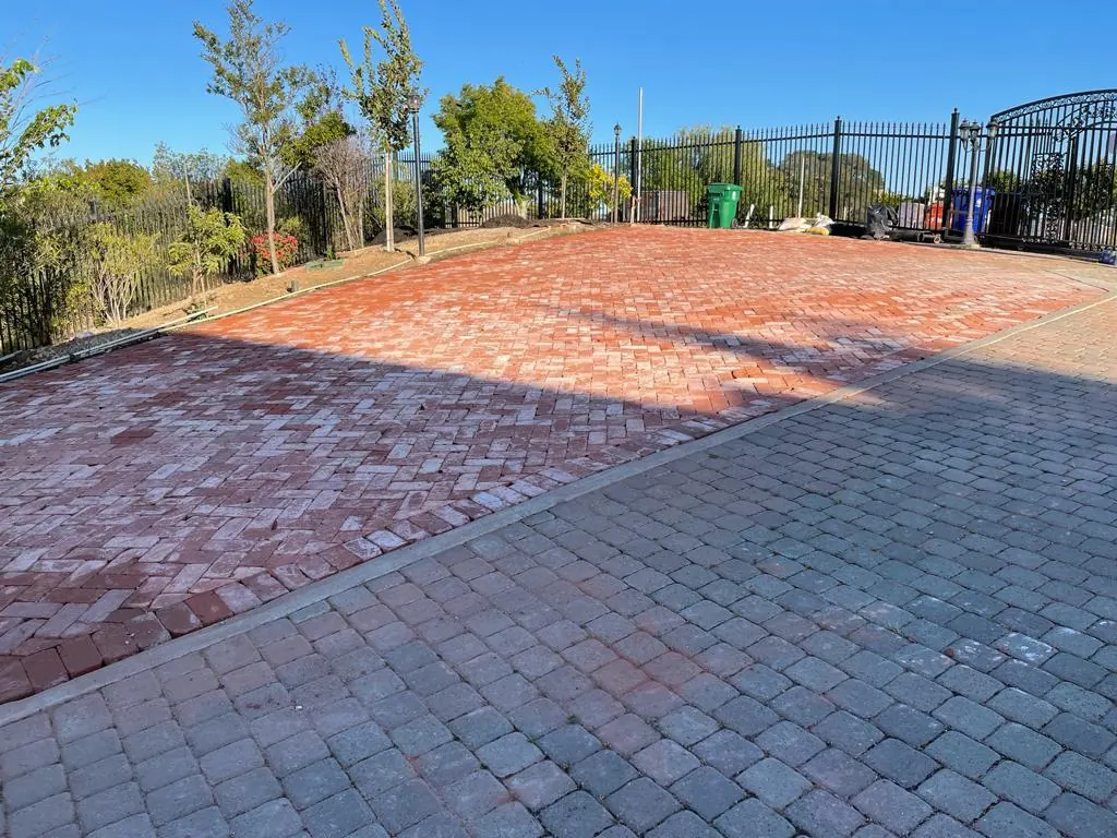 Herringbone paver driveway with a contrasting border
